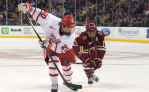 Junior defenseman Brien Diffley evades a BC skater in the 2016 Beanpot Tournament. PHOTO BY MADDIE MALHOTRA/DAILY FREE PRESS STAFF