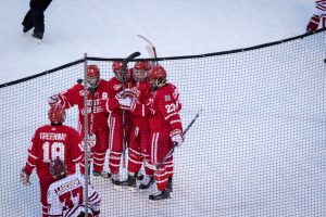 BOSTON, MA - JANUARY 07: The Terriers celebrate their third goal of the game during the second period of the game between the Boston University Terriers and the UMass Minutemen on January 8th, 2016, at Fenway Park in Boston, MA. (Photo by John Kavouris/Daily Free Press Staff)
